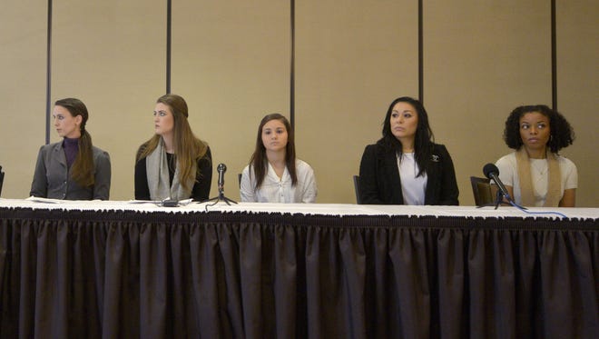 Larry Nassar victims Rachael Denhollander, center left, Sterling Riethman, Kaylee Lorincz, Geanette Antolin, and Tiffany Thomas Lopez talk to the press after the former MSU doctor’s sentencing in the child porn case. He still faces sentencing in the sex assault cases.