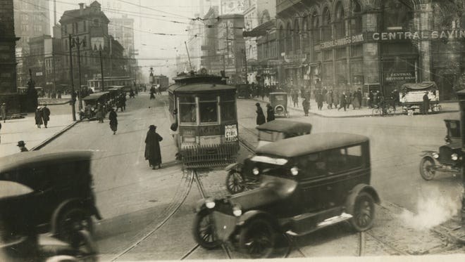 Traffic is heavy on Michigan Avenue in 1924. In the distance, a police officer can be seen in a traffic crow's nest.