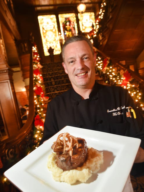 Executive Chef Paul Jackman with a beef tenderloin tower on top of whipped potato and grilled tomato.