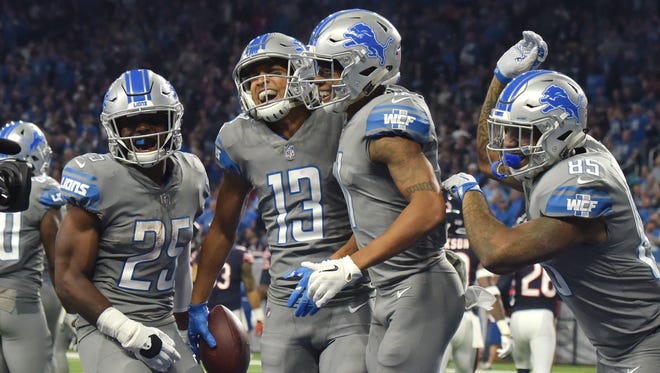 Lions' Theo Riddick, T.J. Jones, Marvin Jones Jr. and Eric Ebron are all smiles after Jones' touchdown, and subsequent 'can-can' dance, in the second quarter.