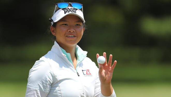Megan Khang acknowledges the crowd after putting on the ninth hole during the first round.