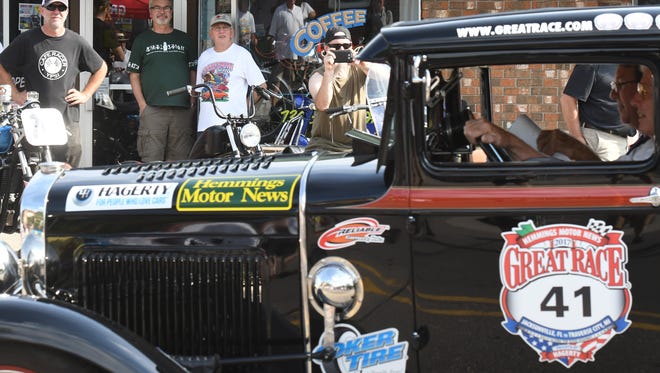 Ypsilanti residents get a rare treat cruising right through Depot Town during a night stop in the Great Race.