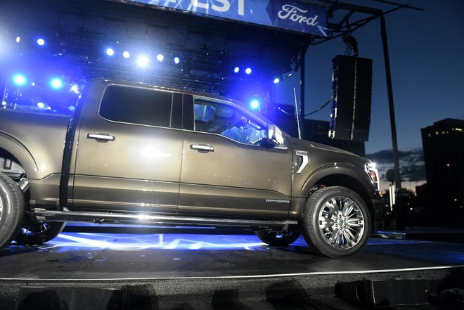 The 2024 Ford F-150 enters the stage during the reveal at the F-150 Fest at Hart Plaza in Detroit on Sept. 12, 2023.