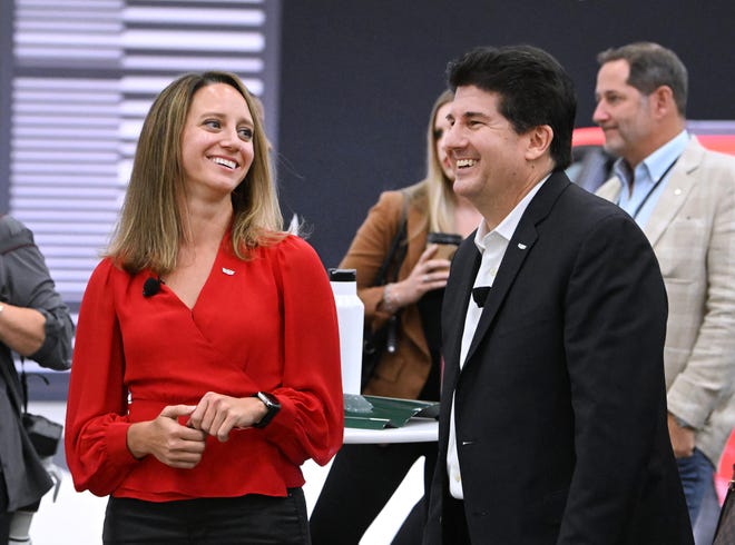 Cadillac Design Manager Candice Willett and Global VP of Cadillac John Roth before a Cadillac reveal of a refreshed version of its gas-powered CT5 sedan at the North America International Auto Show at Huntington Place in Detroit, Michigan on September 13, 2023.
