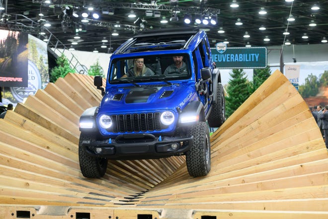 A Jeep Rubicon makes its way through the Camp Jeep track at the North American International Auto Show, at Huntington Place, in Detroit, September 13, 2023.
