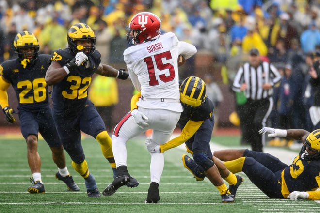 Indiana quarterback Brendan Sorsby is tackled by Michigan defensive back Amorion Walker during the third quarter.