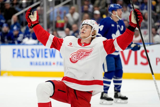 Red Wings defenseman Simon Edvinsson (77) celebrates his goal against the Maple Leafs during the first period.