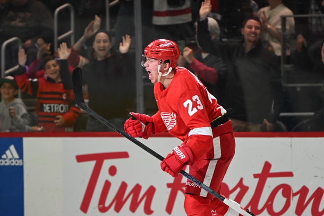 Red Wing Lucas Raymond celebrates his game-tying goal near the end of the third period.