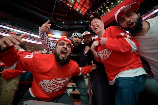 Detroit fans celebrate after left wing Lucas Raymond scored the game winning goal during the overtime period.
