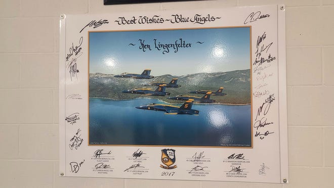 Lingenfelter Collection: After Lingenfelters' 2000 Corvette beat ta Blue Angel's F-18 down the runway, the Angels became fast friends of the collection. A signed poster is on the wall.