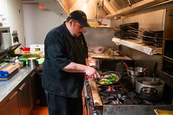 John Jaime, second executive chef at Table No. 2, an upscale restaurant in Detroit's Greektown, works in the kitchen on Thursday, April 18, 2024.