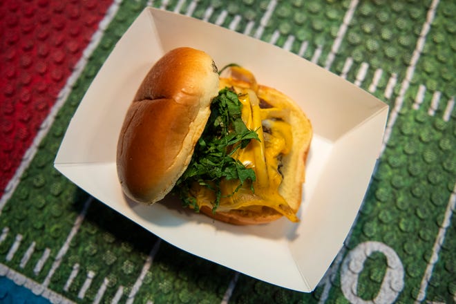 A smashed burger with caramelized onions and cheddar cheese will be featured as part of a special menu for the NFL draft at Table No. 2, an upscale restaurant located in Detroit's Greektown.