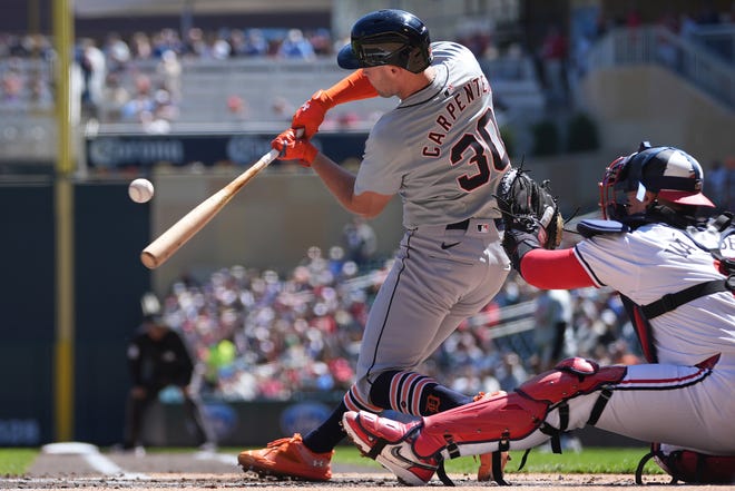 Detroit Tigers' Kerry Carpenter (30) hits an RBI single during the first inning.