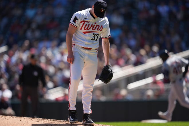 Minnesota Twins pitcher Louie Varland (37) reacts after a two-run home run by Detroit Tigers' Buddy Kennedy during the third inning.