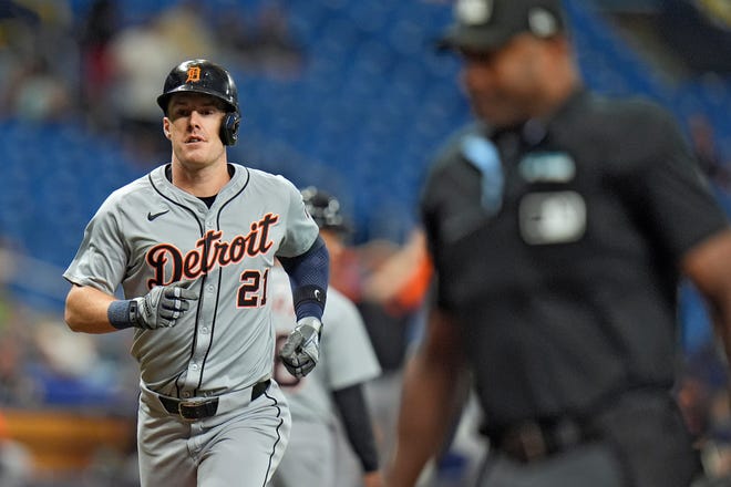 Detroit Tigers' Mark Canha (21) runs the bases after his solo home run off Tampa Bay Rays pitcher Zack Littell during the first inning. The Tigers win, 7 to 1.