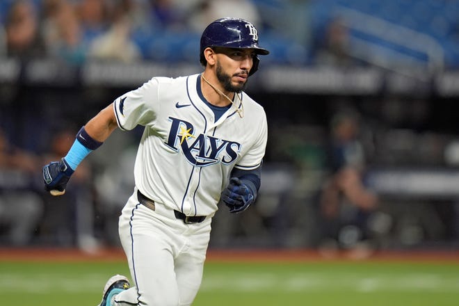 Tampa Bay Rays' Jose Caballero watches his solo home run off Detroit Tigers relief pitcher Shelby Miller during the eighth inning.