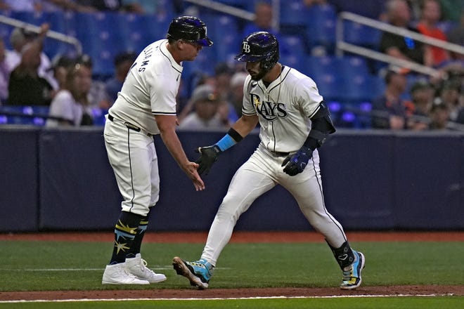 Tampa Bay Rays' Jose Caballero, right, celebrates his home run off Detroit Tigers relief pitcher Shelby Miller with third base coach Brady Williams during the eighth inning.