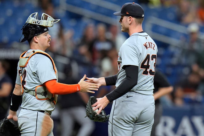 Detroit Tigers catcher Jake Rogers, left, shakes hands with relief pitcher Joey Wentz after closing out the Tampa Bay Rays during the ninth inning.