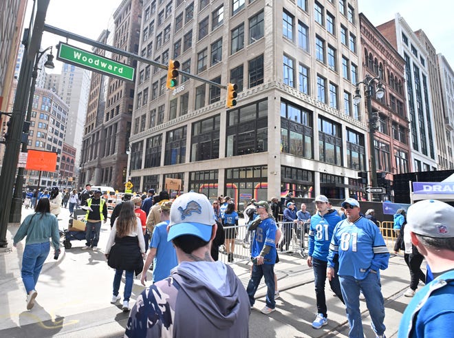 Fans of all teams celebrate the 2024 NFL Draft on the streets of Detroit.
