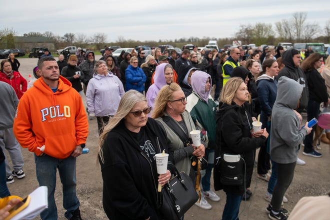 Community members gather for a vigil in honor of Alanah Phillips, 8, and Zayn Phillips, 4, on Friday, April 26, 2024, at the Swan Boat Club in Newport, Michigan.