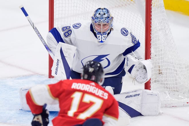 Panthers center Evan Rodrigues (17) attempts a shot at Lightning goaltender Andrei Vasilevskiy (88) during the second period of Game 5 of the first-round series on Monday in Sunrise, Fla.