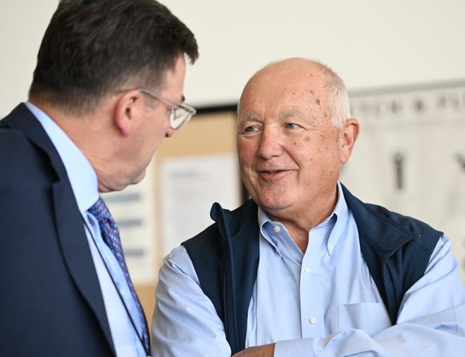 Former U.S. Rep Pete Hoekstra and Michigan Republican Chair, right, talks with reporter Steve Gruber of Michigan Talk Radio before the Donald Trump rally at Avflight Saginaw at MBS International Airport in Freeland, Mich. on May 1, 2024.