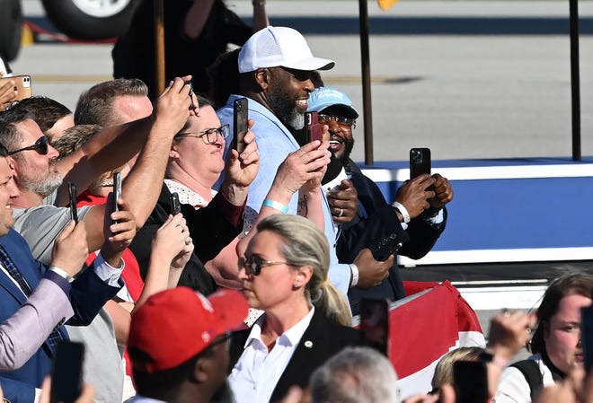Former Detroit Mayor Kwame Kilpatrick (white ball cap), a longtime Democrat, attended Republican former president Donald Trump's campaign rally on Wednesday, May 1, 2024 at MBS International Airport in Freeland, Mich.