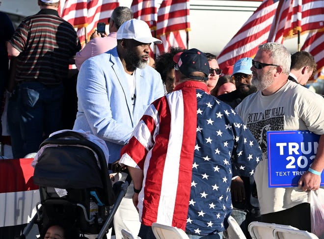 Former Detroit mayor Kwame Kilpatrick talks with people after the Donald Trump rally at MBS International Airport in Freeland, Mich. on May 1, 2024.