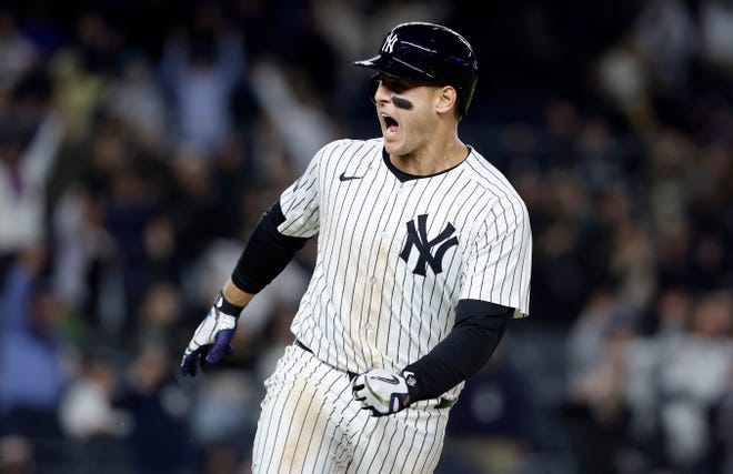 Anthony Rizzo #48 of the New York Yankees reacts after his ninth inning game winning base hit.