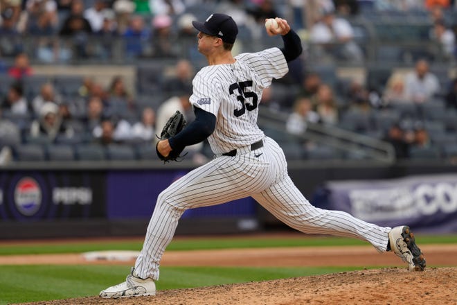 New York Yankees pitcher Clay Holmes delivers against the Detroit Tigers in the ninth inning.