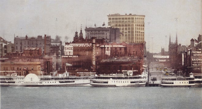 The Detroit Riverfront at Woodward Avenue is populated by steamships.