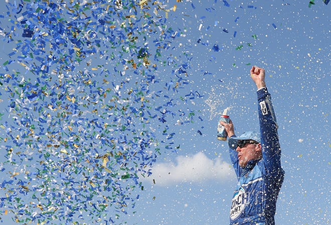 Kevin Harvick, driver of the No. 4 Ford, celebrates in Victory Lane after winning the NASCAR Cup Series Consumers Energy 400 at Michigan International Speedway on August 12, 2018 in Brooklyn, Michigan.