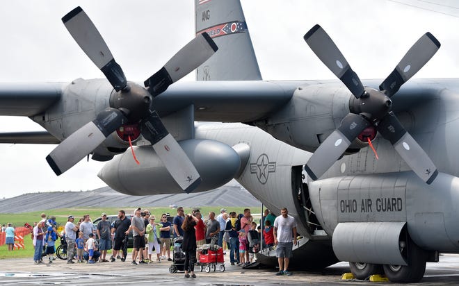 People enter the rear of this 1974 C-130 H1 airplane from the Ohio Air National Guard's 179th Airlift Wing based at the Mansfield-Lahm Airfield in Mansfield, Ohio.