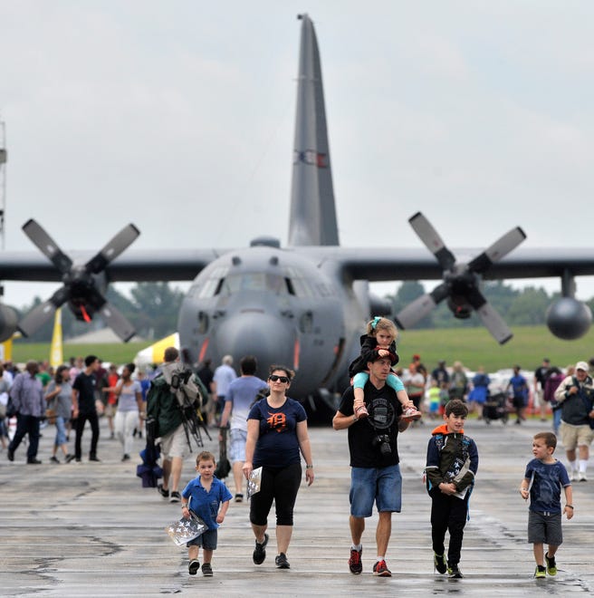 The Mathew family, of Shelby Twp., walks in front of a C-130 H1.