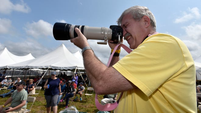 Retired Madison Heights fire fighter and aviation enthusiast Tim Kennedy, of Fraser, takes pictures at his 18th air show.