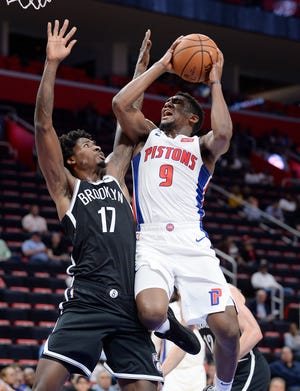 Pistons' Langston Galloway (9) shoots over the Nets' Ed Davis in the second quarter. Galloway was fouled on the play. Galloway had a team- high 24 points and two assists.