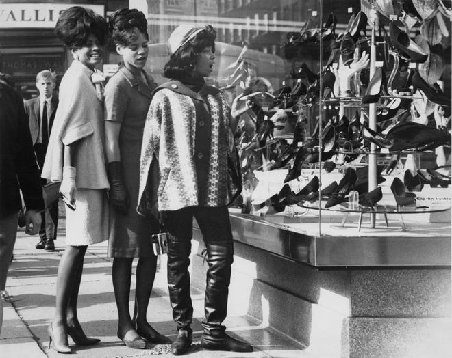 The Supremes are shown shopping on  Oxford Street during their 1964 visit to London.  From left: Mary Wilson, Florence Ballard and Diana Ross.  Beginning that year with "Where Did Our Love Go?"  the Supremes produced a phenomenal string of 10 No. 1 hits.