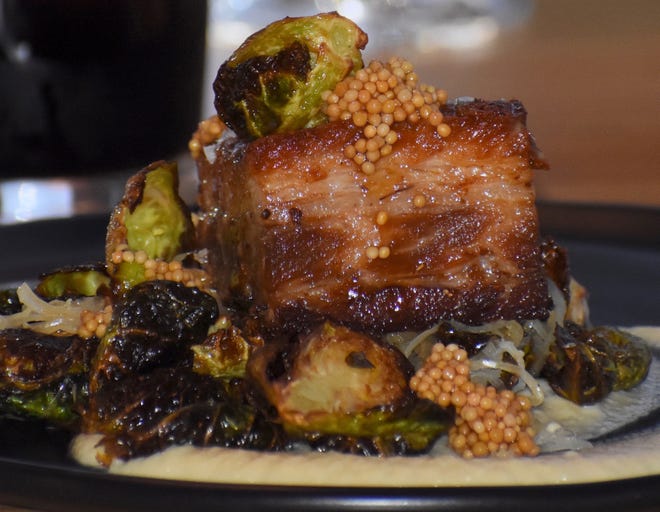 This evening ' s offering " From the Butcher ' s Case " is pork belly glazed with apple butter and paired with Brussels sprouts and sauerkraut. The highly-seasonal menu changes frequently.