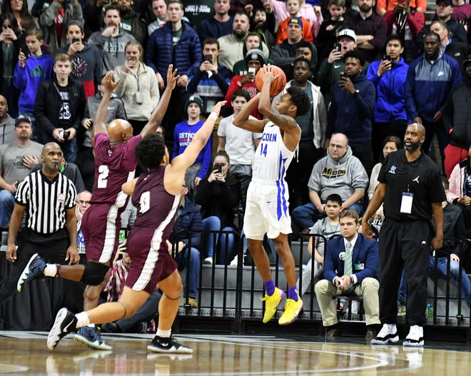 Ypsilanti Lincoln guard Jalen Fisher lets fly the winning shot in the Division 1 championship game Saturday.