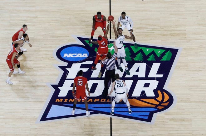 Players get set for the opening tip during the first half between Michigan State and Texas Tech in the semifinals of the Final Four NCAA college basketball tournament, Saturday, April 6, 2019, in Minneapolis.