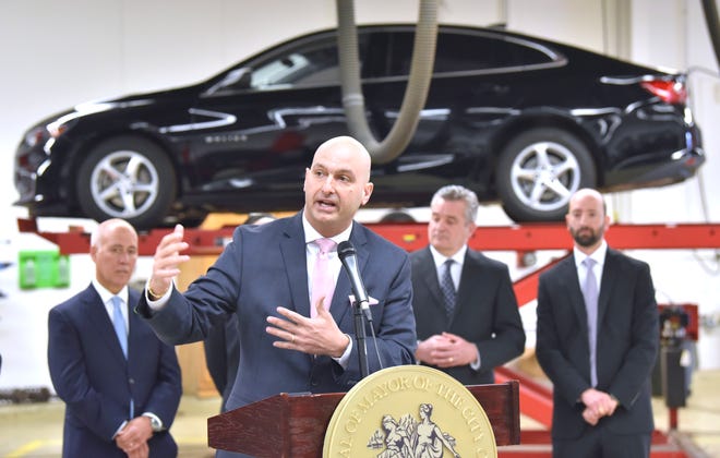 DPSCD Superintendent Dr. Nikolai Vitti addresses attendees at the celebration of the $10 million revitalization of the Breithaupt Career Technical Center, Thursday, April 18, 2019.  Behind him is a Chevy Malibu used by auto shop students to run diagnostics and learn automobile functions.