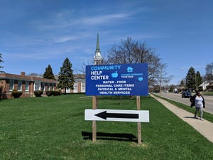 A help center sign outside Bethel United Methodist Church.