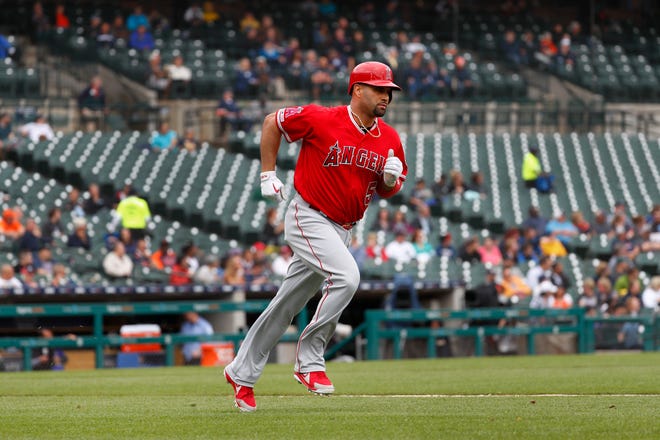 The Angels' Albert Pujols rounds the bases after hitting a solo home run in the third inning. It was his 2,000th career RBI.