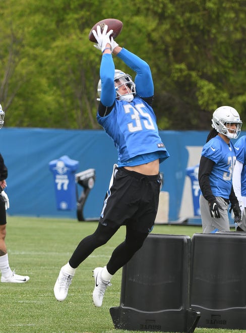 Lions safety Miles Killerew goes up after a pass during drills.