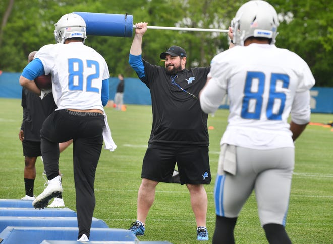 Lions head coach Matt Patricia adds some pop to the obstacles drill during OTA.