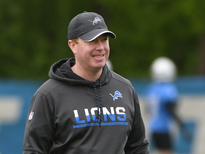 Lions general manager Bob Quinn watches over practice Tuesday.