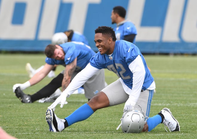 Lions linebacker Devon Kennard stretches out at the start of practice.