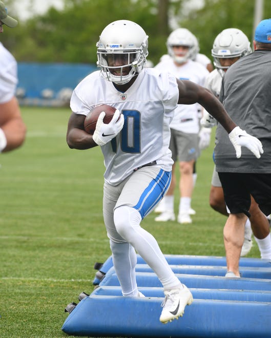 Lions wide receiver Brandon Powell works his way through obstacles during drills.