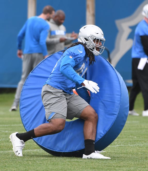 Lions linebacker Jalen Reeves-Maybin works with a ring obstacle during drills.