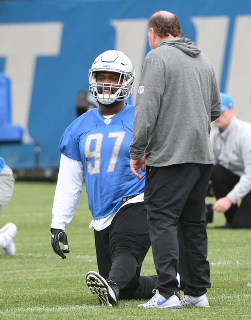 Lions defensive tackle Darius Kilgo stretches out at the start of practice.
